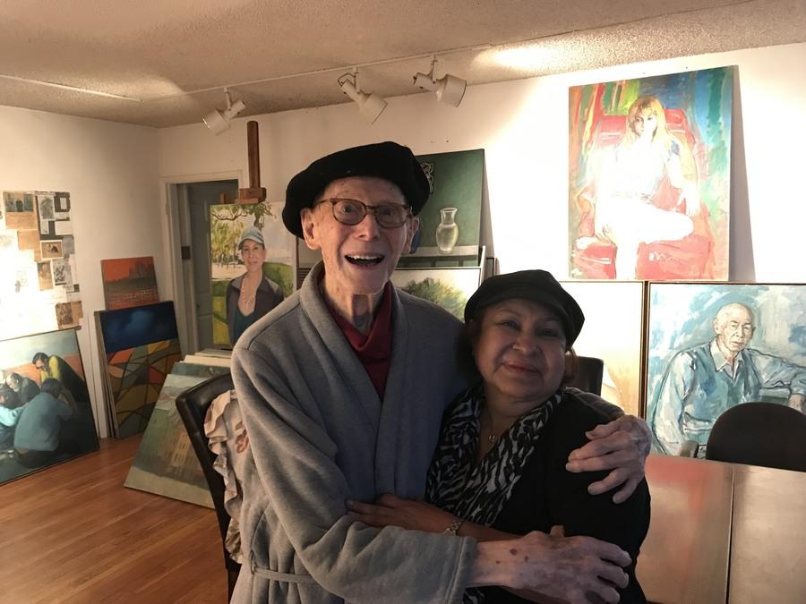 Kalman Aron and his wife, Miriam. The walls and floors of their apartment are covered with Kalman's works.