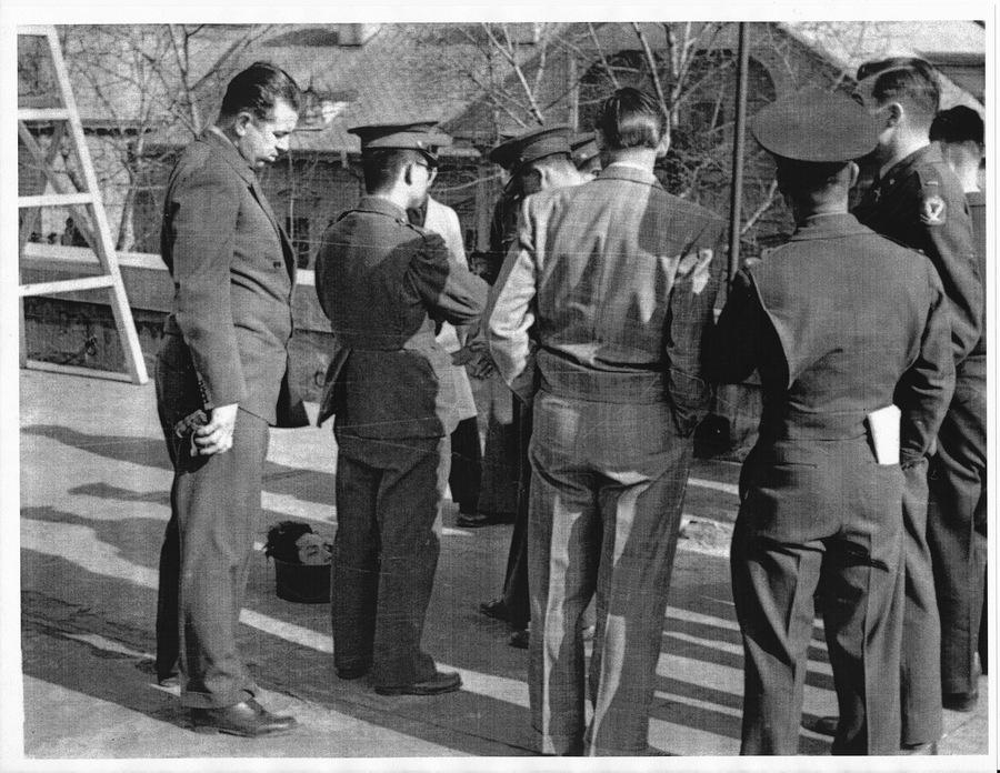 Nichols is seen here (far left) standing above severed human head, alongside unidentified US and South Korean officials in Seoul. Severed heads of Communist guerilla leaders were often sent to the South Korean capital to show progress in the civil war, Ha