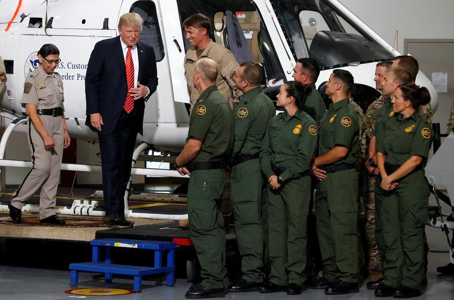 US President Donald Trump greets Border Patrol agents