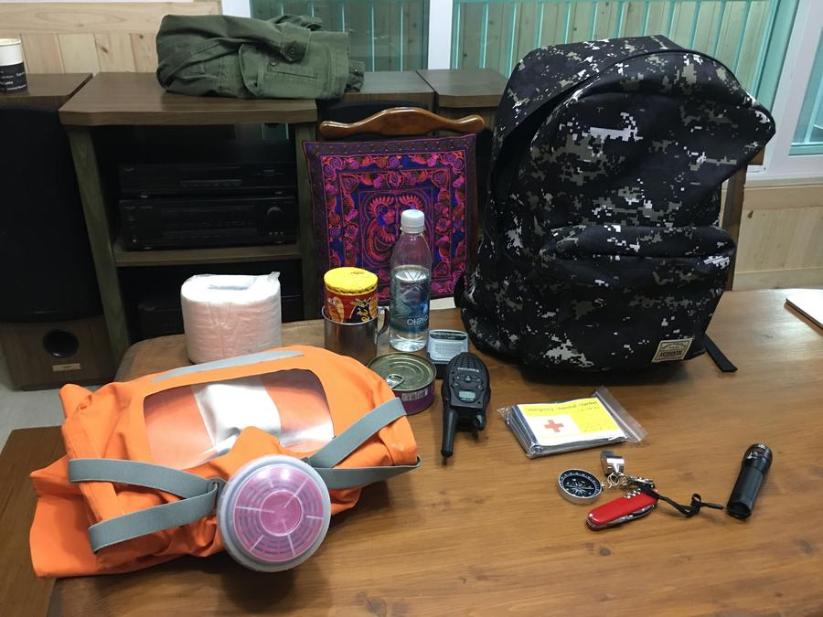 Woo Seung-yep keeps a backpack filled with emergency supplies, including canned food and a gas mask.