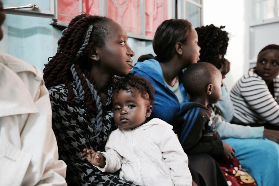 Young women waiting to be seen at the Family Health Options Kenya