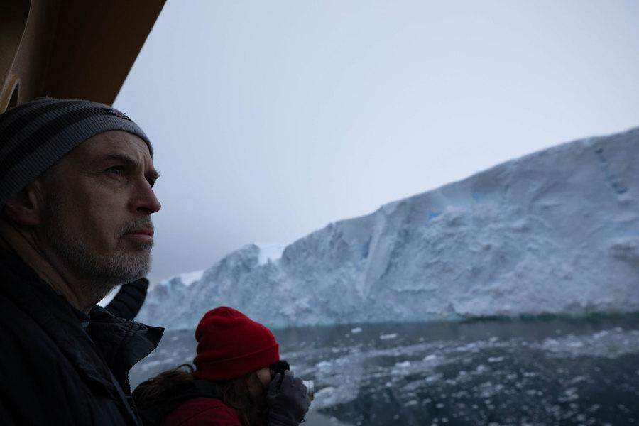 Chief Scientist Rob Larter is shown in the nearground looking out at Thwaites glacier on the morning of arrival.