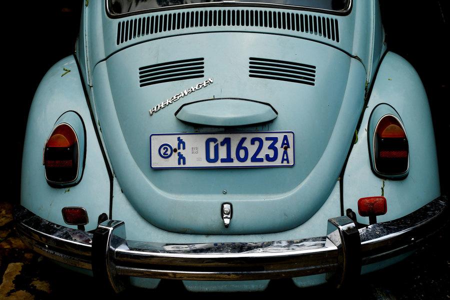 The rear end of a light blue Volkswagen Beetle car is shown with an Ehtiopian license plate.