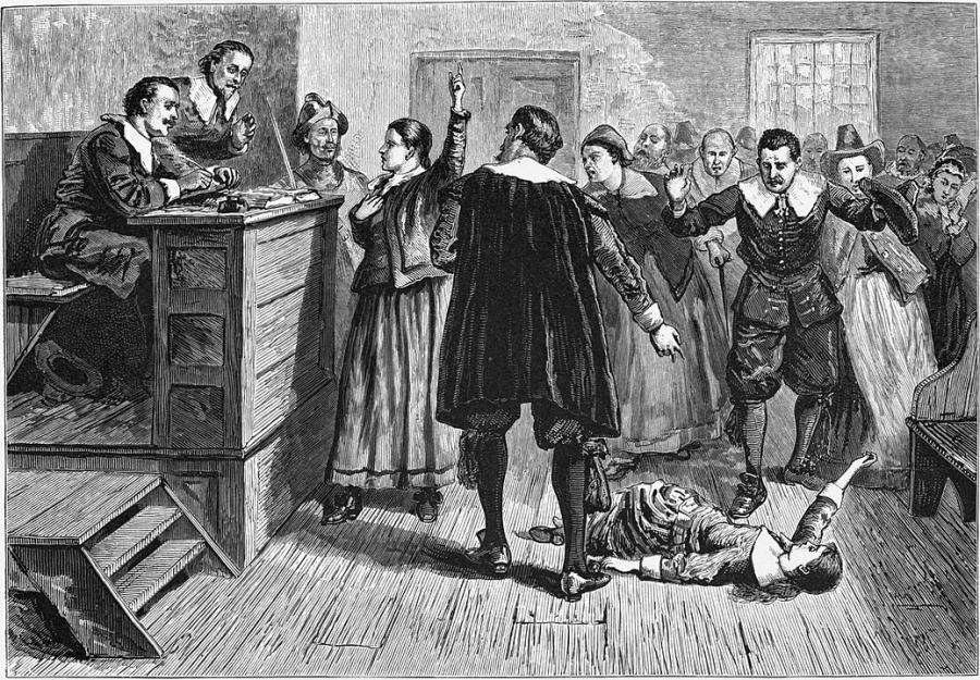 An illustration of a woman in a courtroom surrounded by men. 