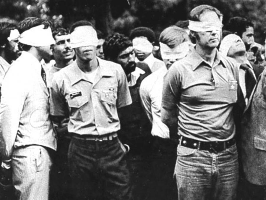 Blindfolded US hostages and their Iranian captors outside the US Embassy in Tehran, Iran, 1979.