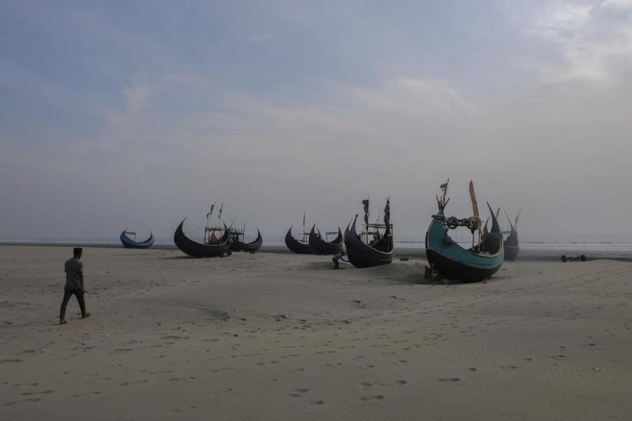 Fishing boats sitting on a beach