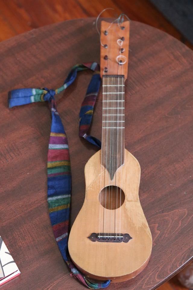 A picture of the jarana musical instrument. It looks like a small guitar.