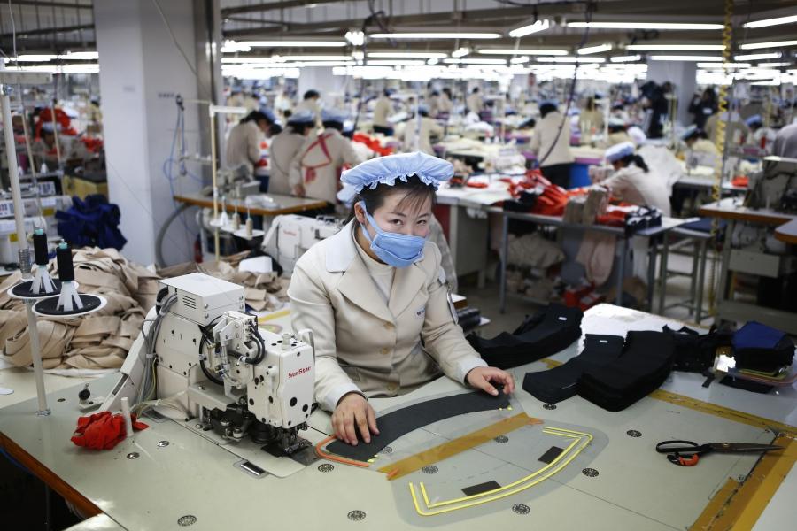 A North Korean employee works in the factory of a South Korean company at the Joint Industrial Park in the Kaesong industrial zone, a few miles inside North Korea from the heavily fortified border, Dec. 19, 2013.