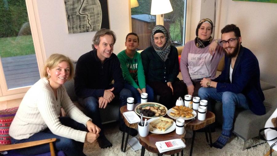 Sabine and Alexander Kluge (left) are helping a family of refugees from Aleppo, Syria settle into their new life in Germany.  