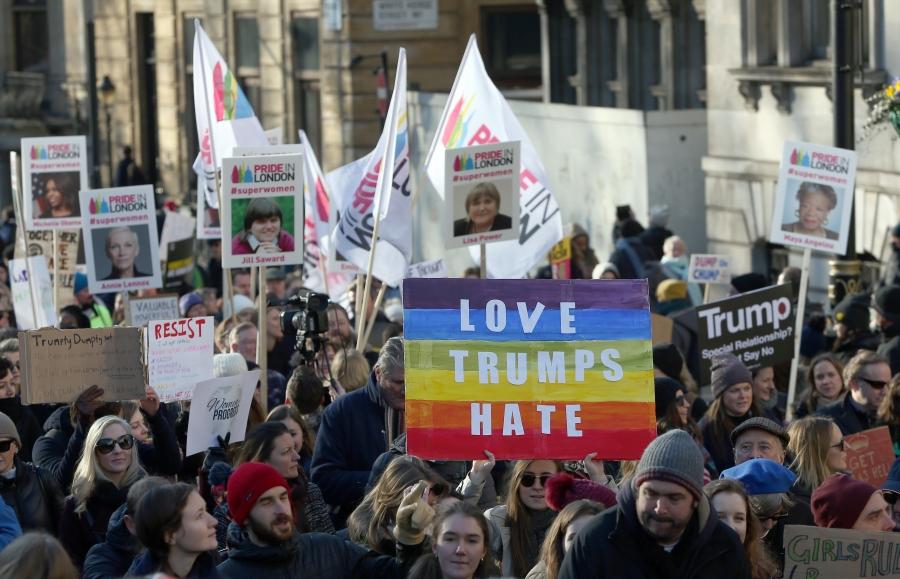 Protesters take part in the Women's March on London, as they walk from the American Embassy to Trafalgar Square, in central London