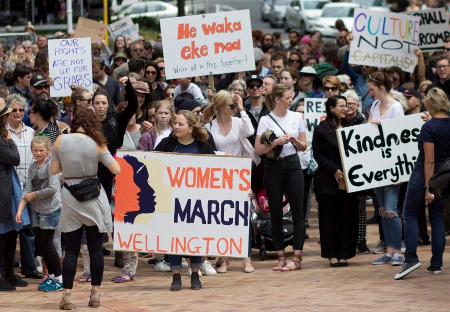 Participants of a rally regarding women's rights hold placards as they march in Wellington, New Zealand, January 21, 2017.