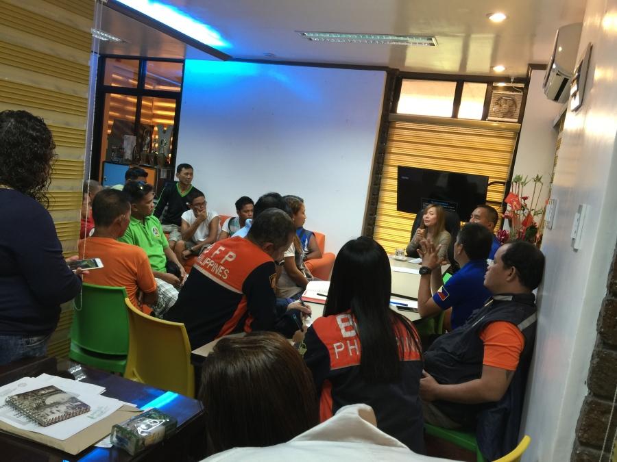 Stephany Uy-Tan is at the head of the table, planning disaster response in Catbalogan.