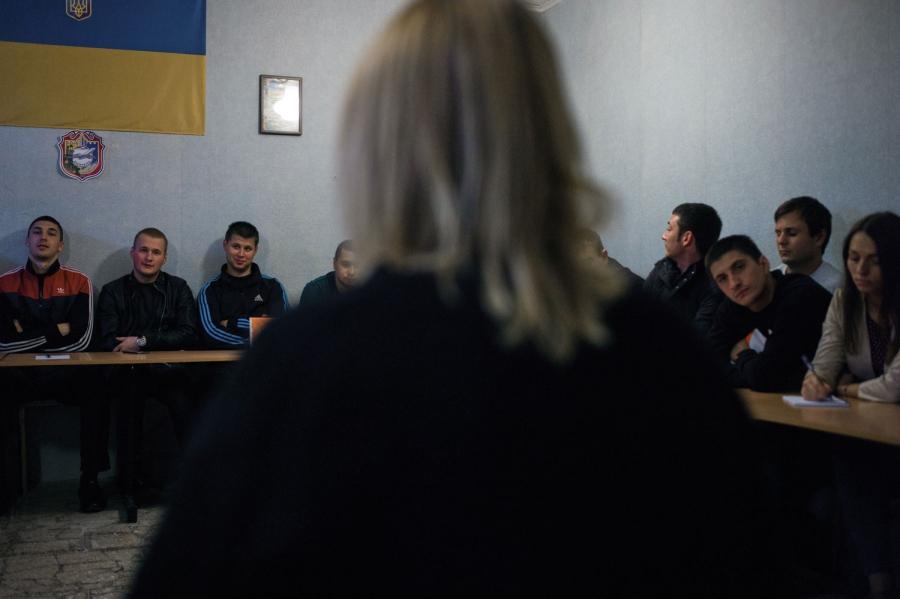 Sveta Moroz from NGO Svitanok Club educates Borispol's patrol officers on modern approaches to dealing with drug users.