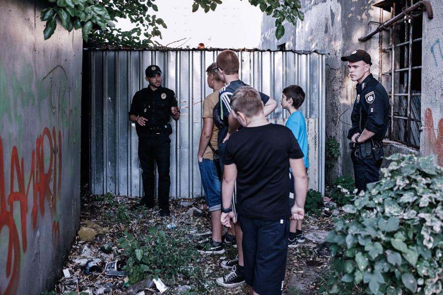 Lt. Yaroslav Petrushka explains the dangers of drug use to local kids in Borispol.