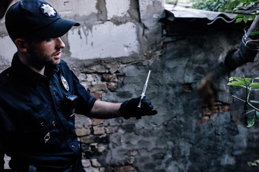 Lt. Yaroslav Petrushka finds a drug-filled syringe at a place popular with drug users.