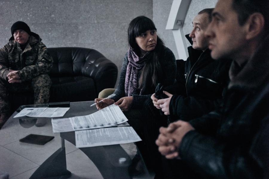 Olga Ponomareva, an internally displaced person (IDP) herself, from Svitanok Club, helps newly arrived IDPs to settle down by finding housing and assisting with paperwork.