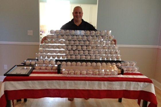 Randy Kaplan with his collection of autographed baseballs