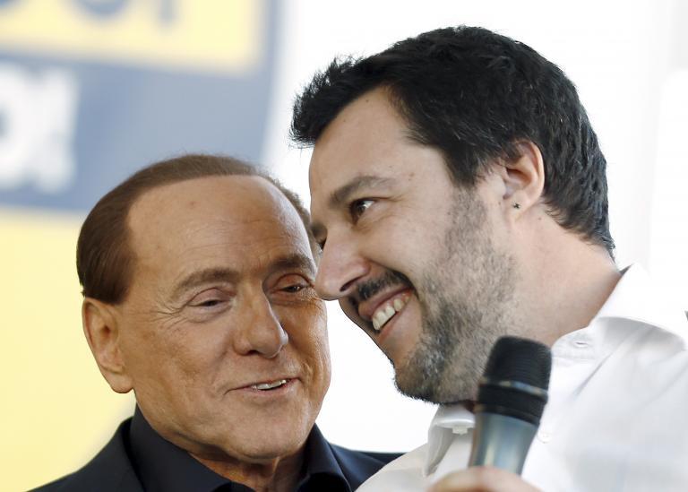 Forza Italia party (PDL) leader Silvio Berlusconi (L) talks with Northern League leader Matteo Salvini during a rally in Bologna, central Italy, on Nov. 8, 2015.