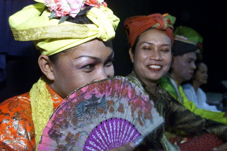Members of the Bissu, a transvestite community from South Sulawesi, prepare to give a performance in Jakarta.