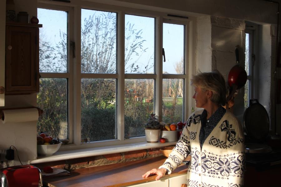 Jill Pearson at home The realigned coastline has brought the new sea wall directly outside her kitchen window