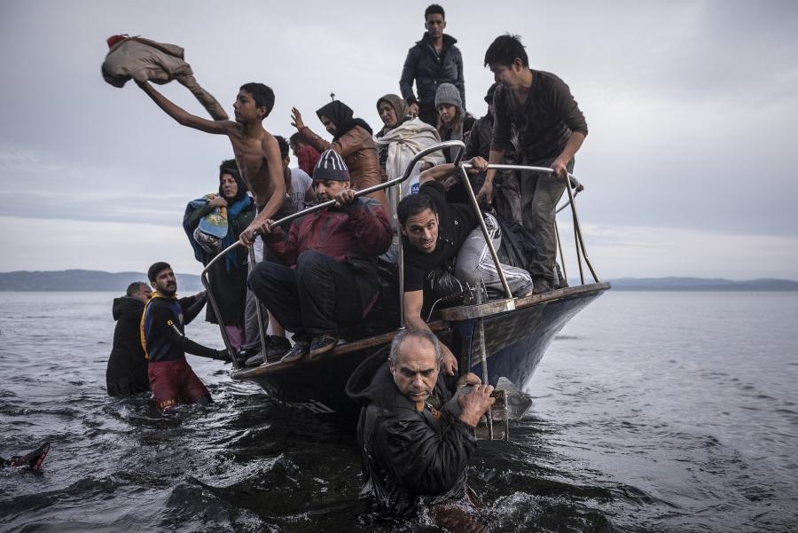 Refugees arrive by boat near the village of Skala on Lesbos, Greece, 16 November 2015.