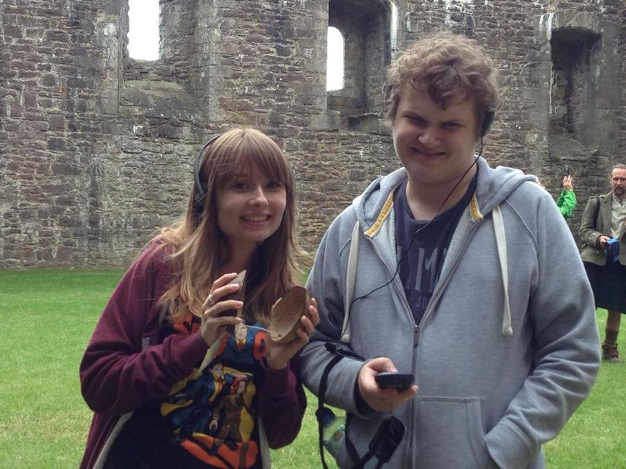 Thomas and Ellen Woolf listening to the Terry Jones tour of Castle Doune, where Monty Python and the Holy Grail was filmed. Out of frame to the left is the wall from which the French knights taunted. Note the coconut halves.