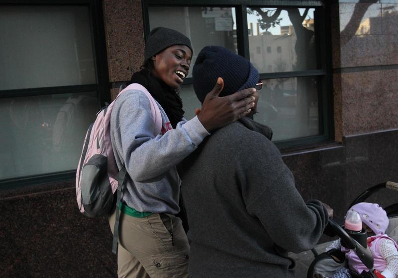 Carine and her girlfriend Gertrude, who were persecuted for being gay in Cameroon, push their daughter down the street in San Francisco's Tenderloin district. The two women have been granted asylum in the US.