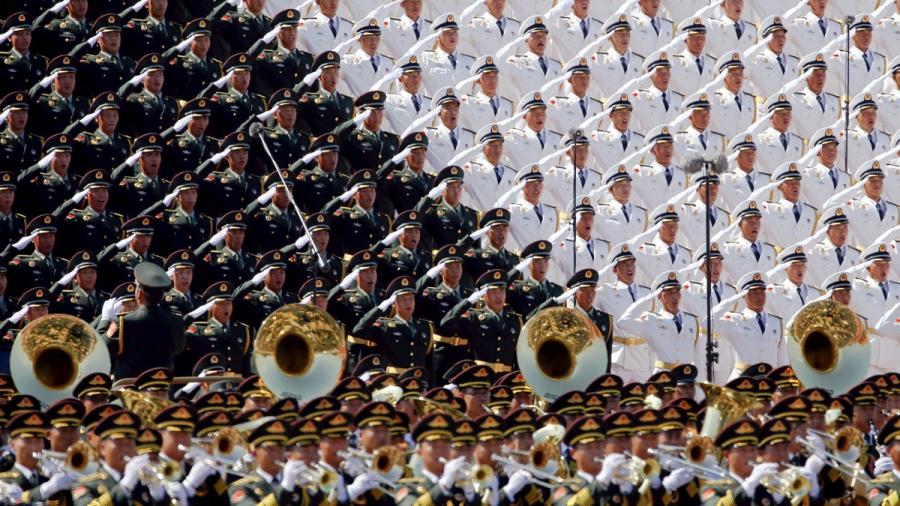 Military band sing and salute at the Tiananmen Square at the beginning of the military parade marking the 70th anniversary of the end of World War II, in Beijing, China, September 3, 2015.