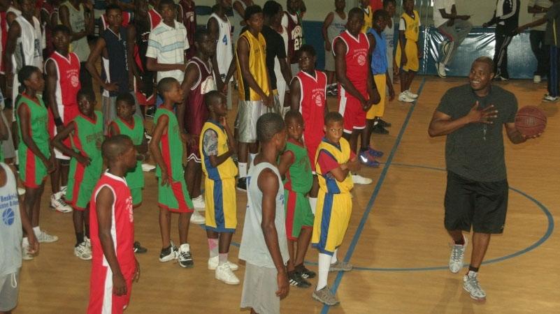 Pierre Valmera leading a youth basketball camp in Haiti.