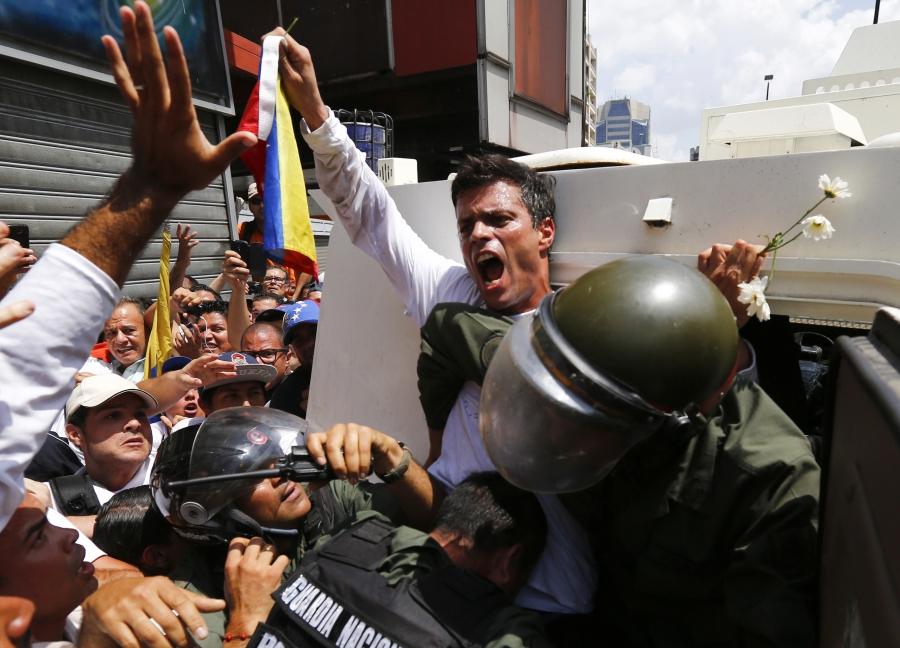 The dramatic moment, on Feb. 18, 2014, when Venezuelan opposition leader Leopoldo Lopez surrendered to National Guard in Caracas