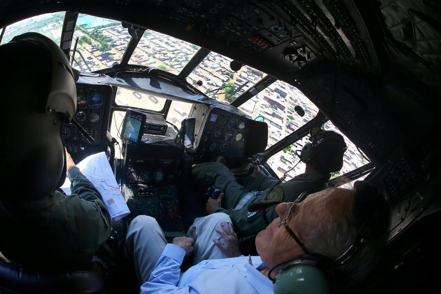 Peru's president in a helipcopter looking at flood