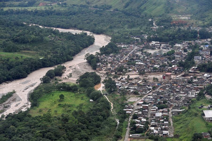 An aerial view shows a flooded area after heavy rains caused several rivers to overflow, pushing sediment and rocks into buildings and roads in Mocoa, Colombia on April 1.