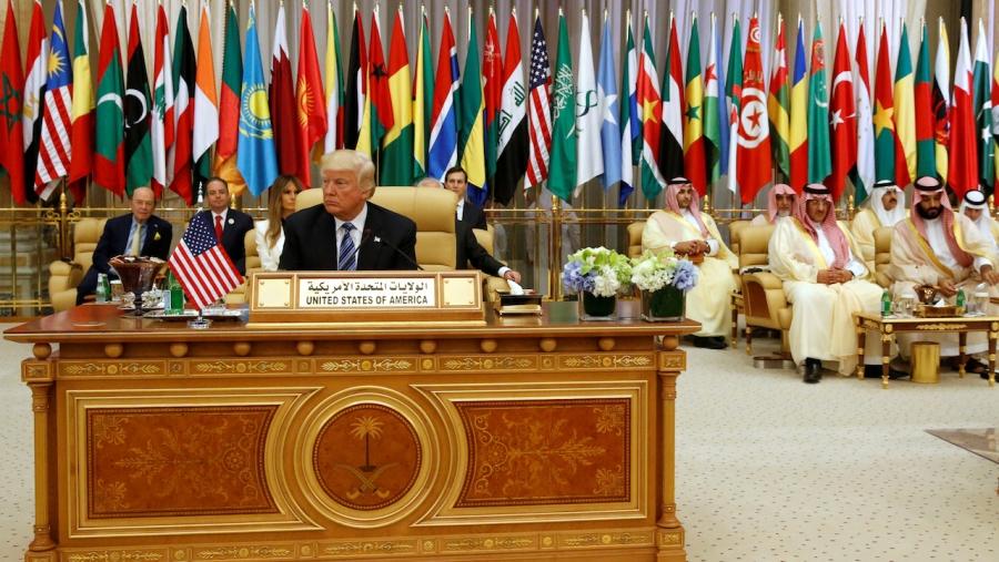 Donald Trump takes his seat before his speech to the Arab Islamic American Summit in Riyadh, Saudi Arabia, May 21, 2017.