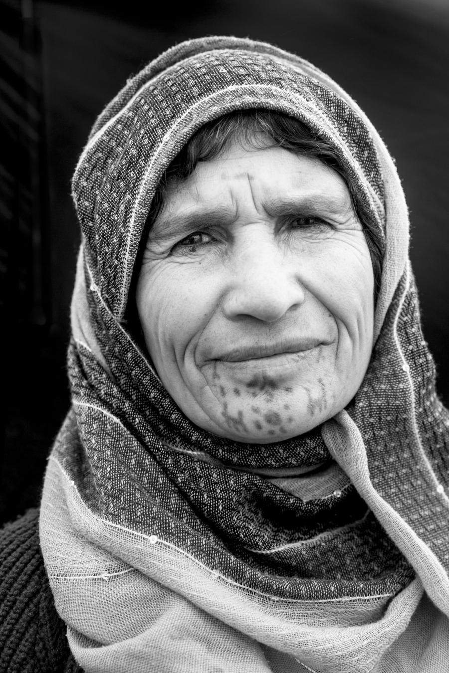 Amina Saleh--60 year-old woman from Musko, a village of Kobani, at Bulgur Fabrikası refugee camp in Suruc, Turkey, October 25, 2014. Mother of 6, she got her face tattooed when she was about 10 years old.