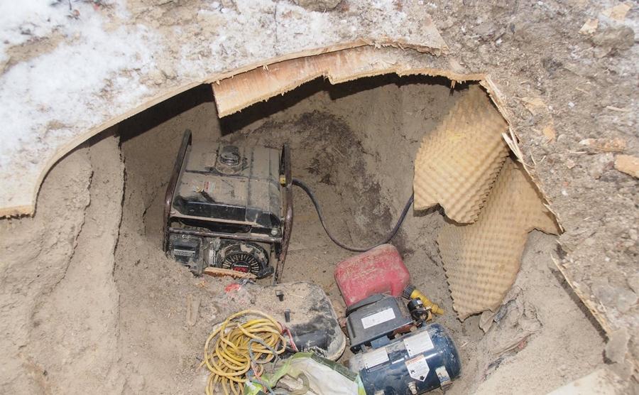A generator discovered buried nearby that supplied electricity to the tunnel via a buried power supply.