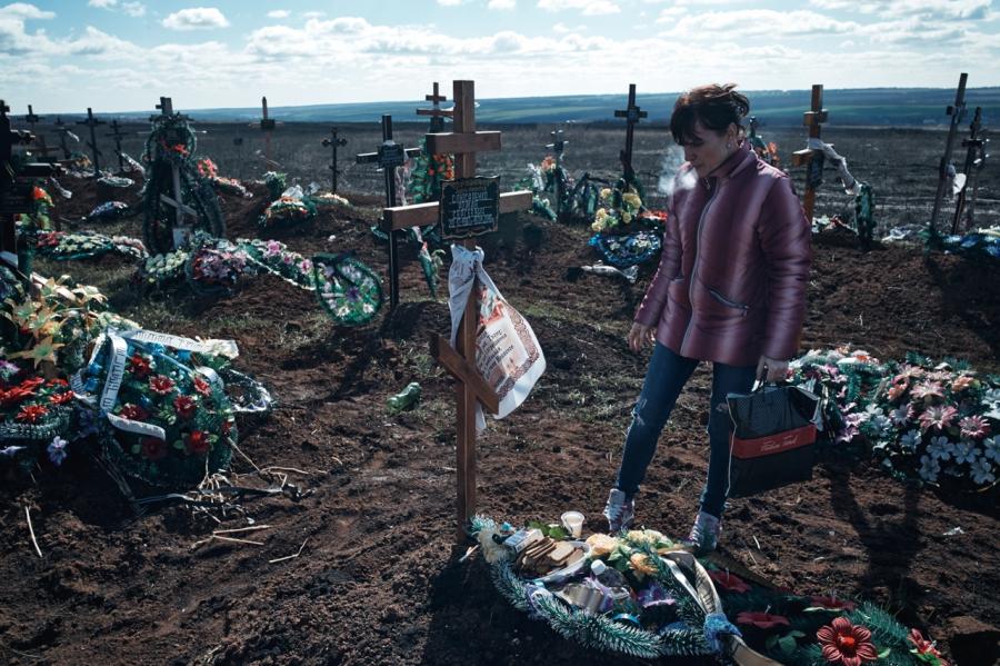 Tatiana, 33, visiting the grave of her husband who died of AIDS in January 2016.