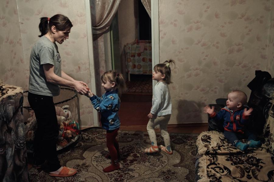 Tatiana, 33, with her three children. She contracted HIV from her husband who was a drug user and died from AIDS in January 2016. They had to flee the war during heavy fighting and right now she lives in Kramatorsk, supported solely by NGOs and church gro