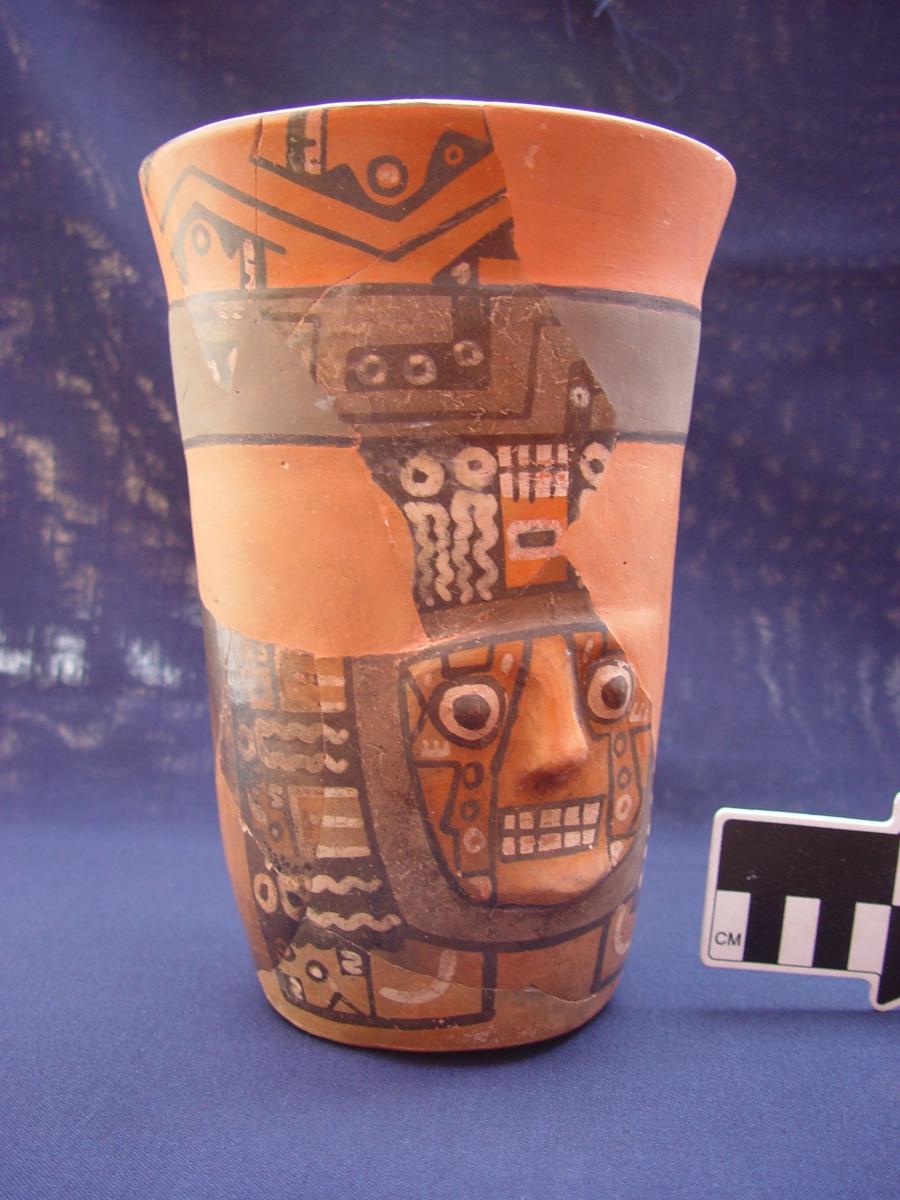 A Wari drinking vessel from Cerro Baul with a half-gallon capacity, depicting the face of a principal Wari deity. Courtesy of the Cerro Baul Archaeological Project