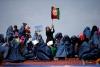 Supporters of then-Afghan presidential candidate Ashraf Ghani Ahmadzai attend an election campaign in Kunduz province, northern Afghanistan March 19, 2014. Now president, Ghani and First Lady Rula Ghani are outspoken supporters of women's rights.