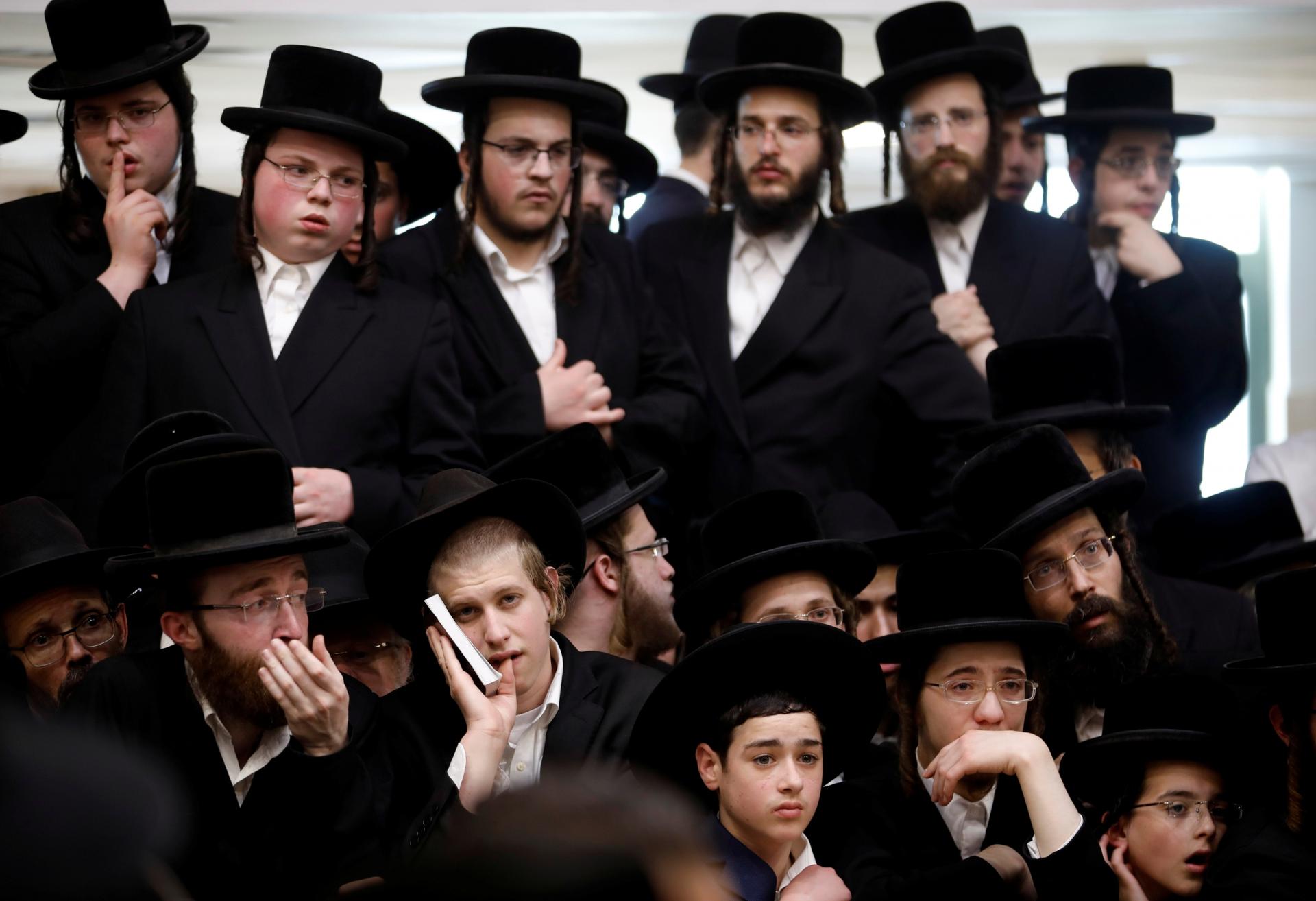 A large group of men in Orthodox Jewish clothing. 