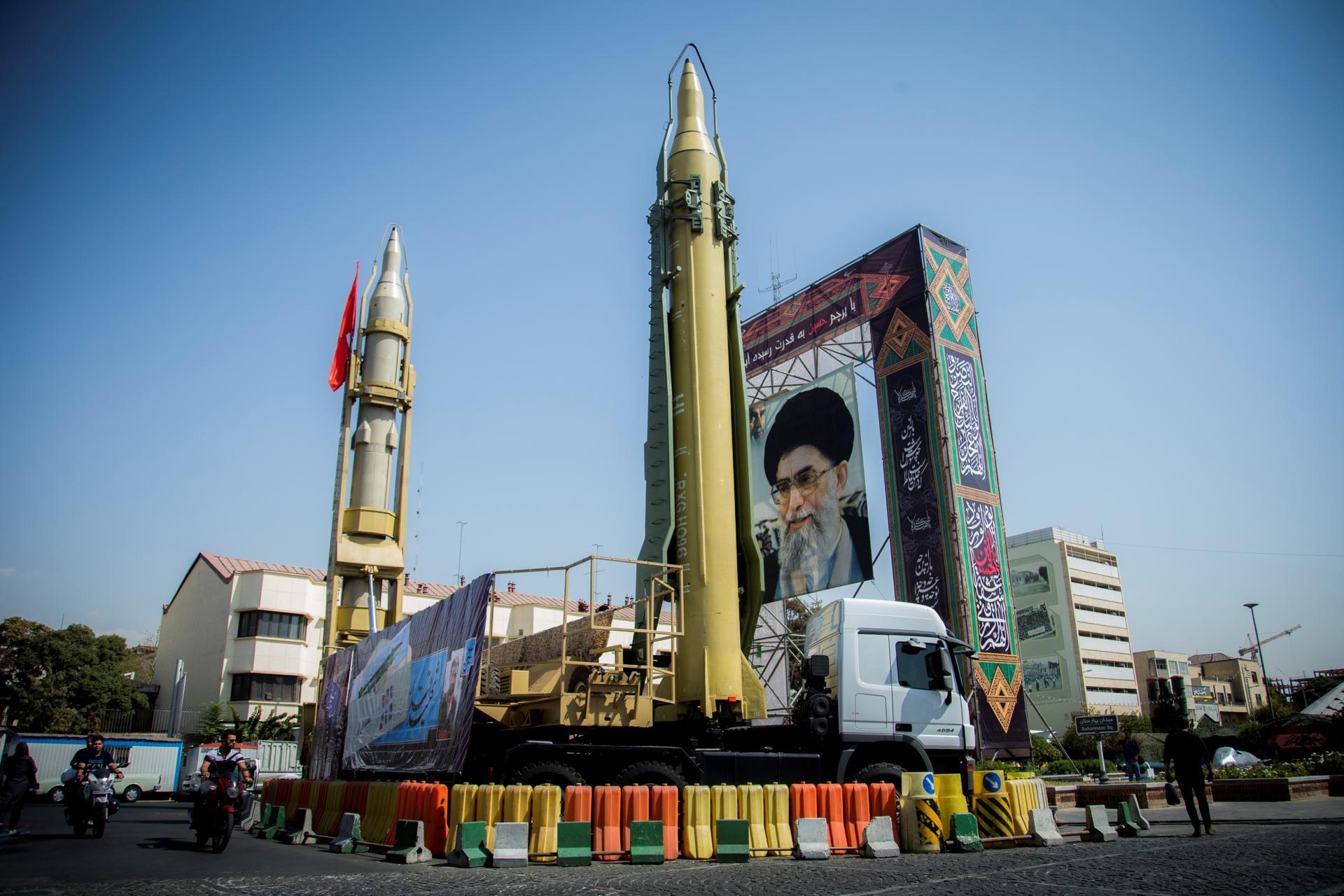 A display in an Tehran shows a portrait of Ayatollah Khamenei and two missiles. 