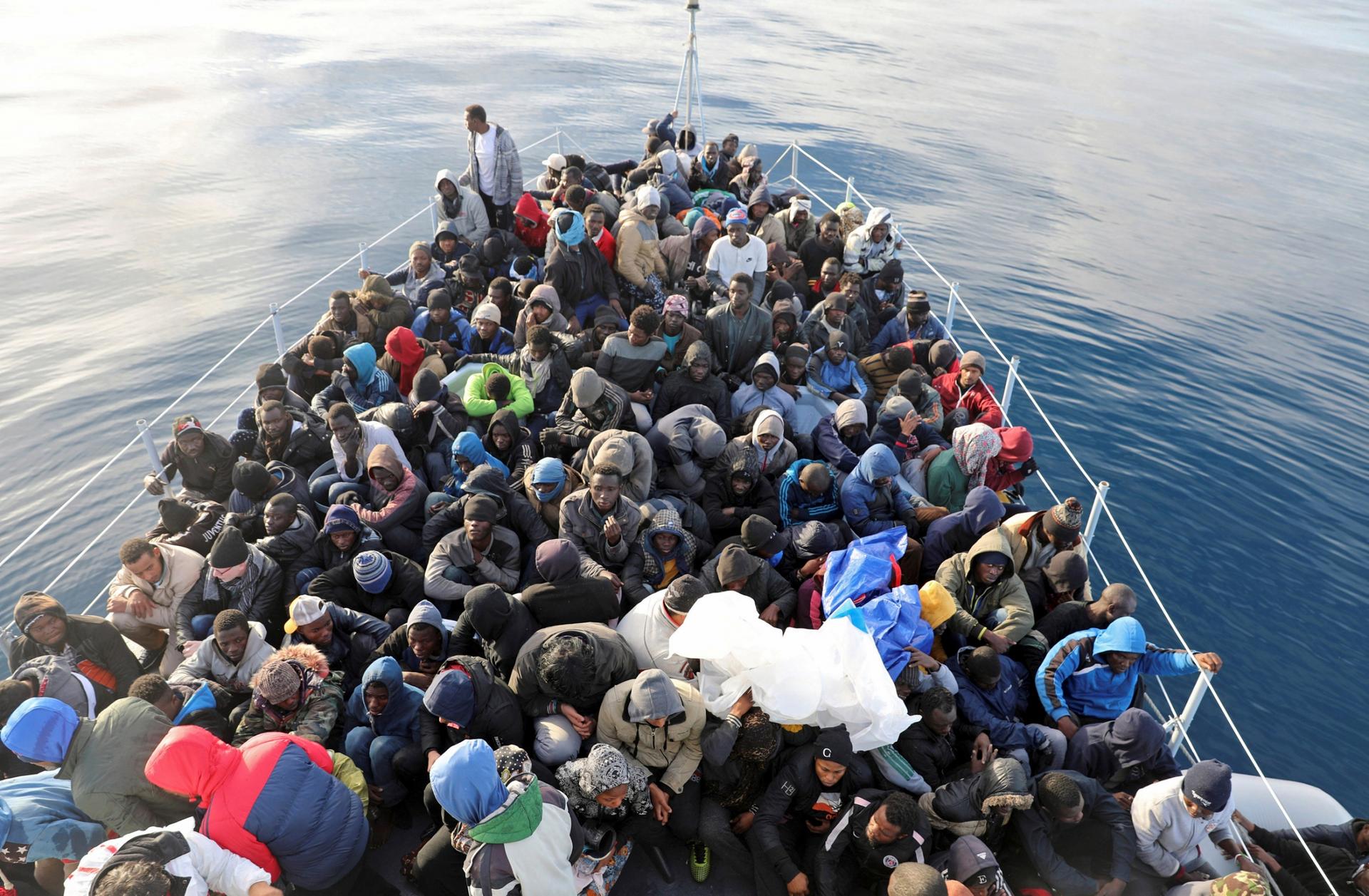 The front of a boat is packed full with migrants who have been rescued in the Mediterranean.