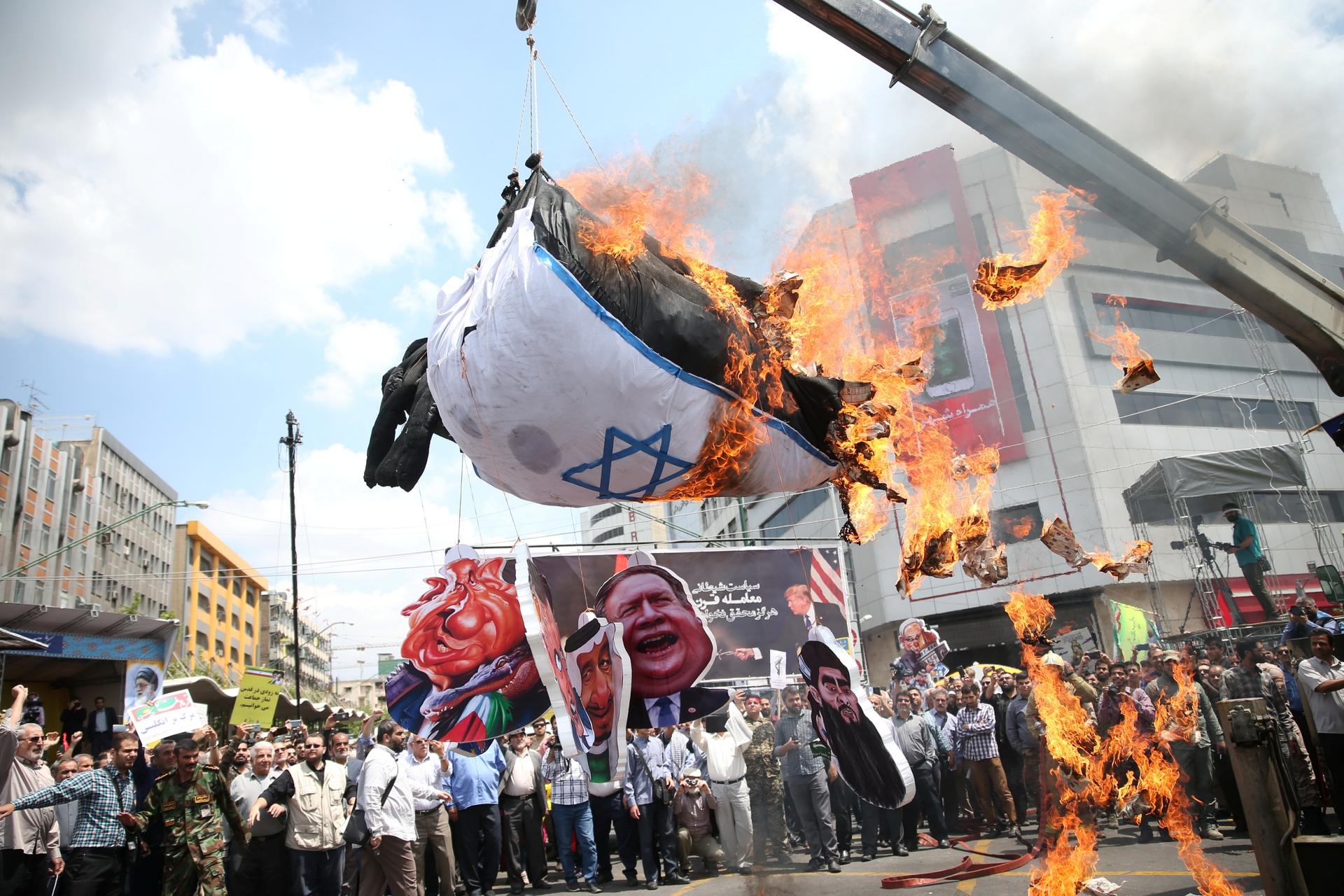 Iranians burn an Israeli flag during a protest marking the annual al-Quds Day (Jerusalem Day) on the last Friday of the holy month of Ramadan in Tehran, Iran May 31, 2019. 