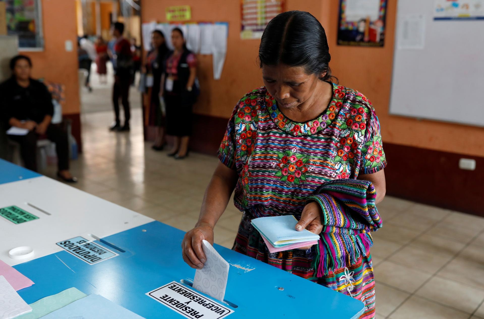 A woman votes at a polling station during the first round of Guatemala's presidential election in San Pedro Sacatepequez, Guatemala, June 16, 2019. 