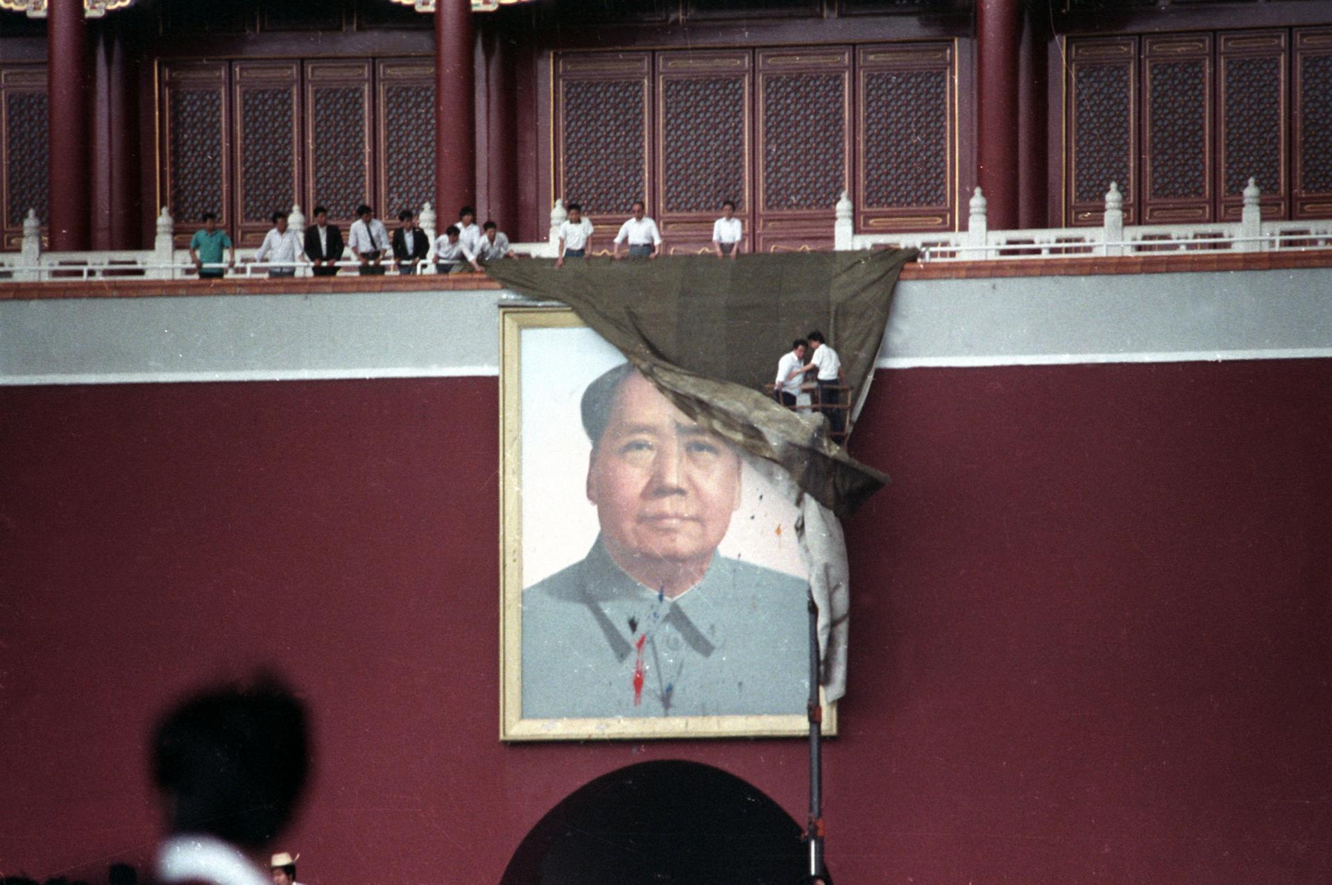 A portrait of Chairman Mao is covered. 