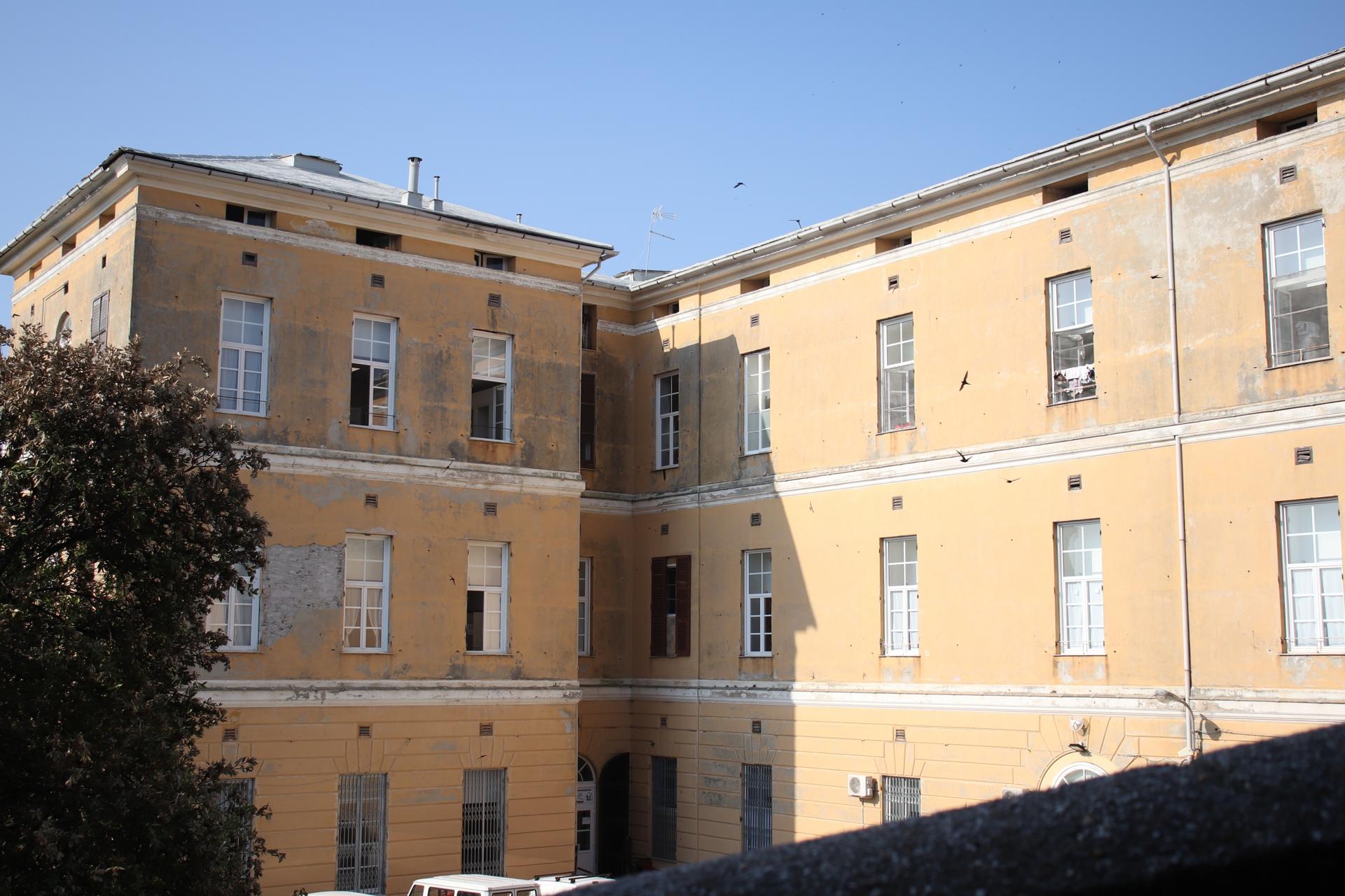 an old hospital in italy has become a refugee center