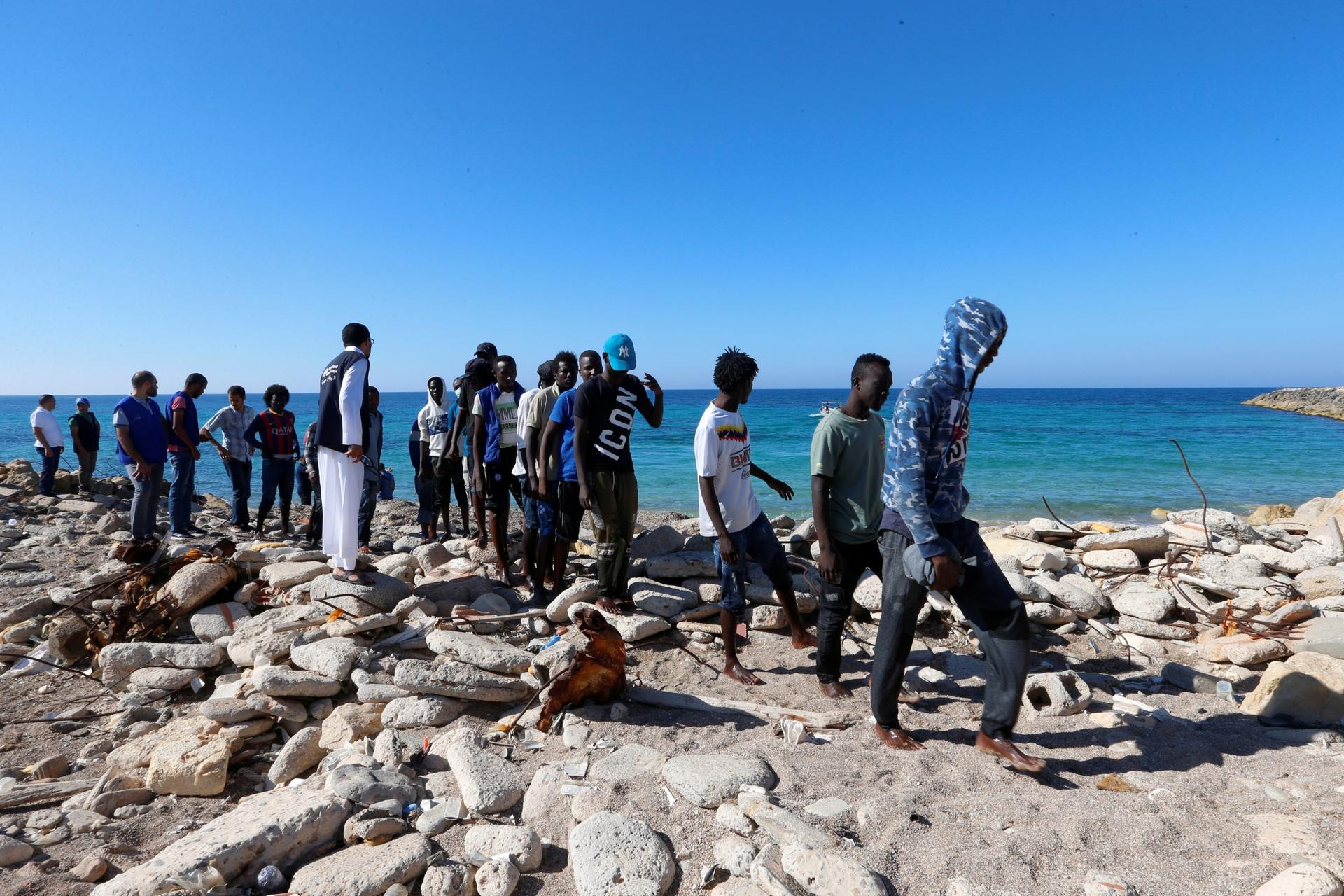 African migrants rescued by Libya coast guard at seashore 