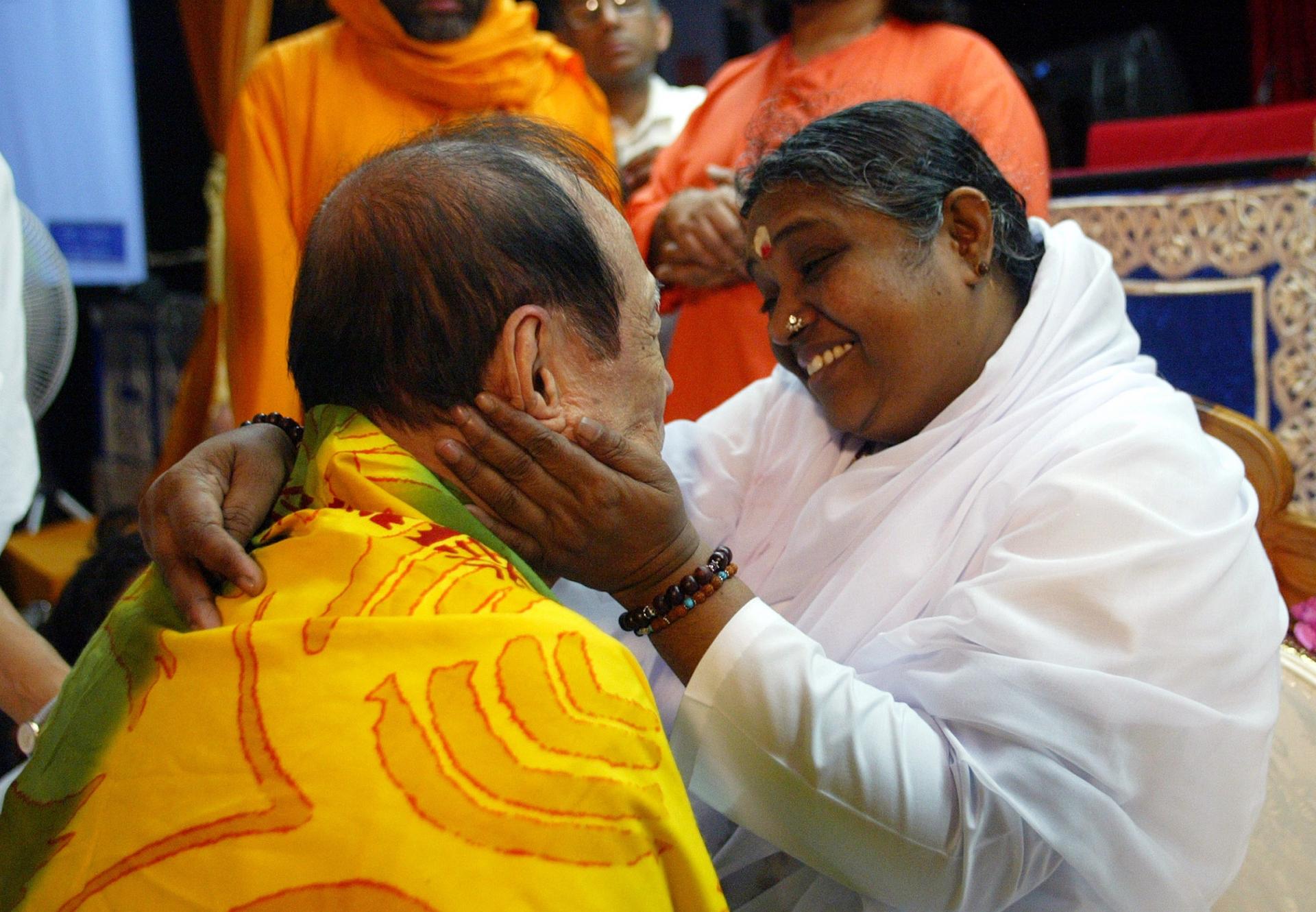 Amma looks lovingly at a devotee