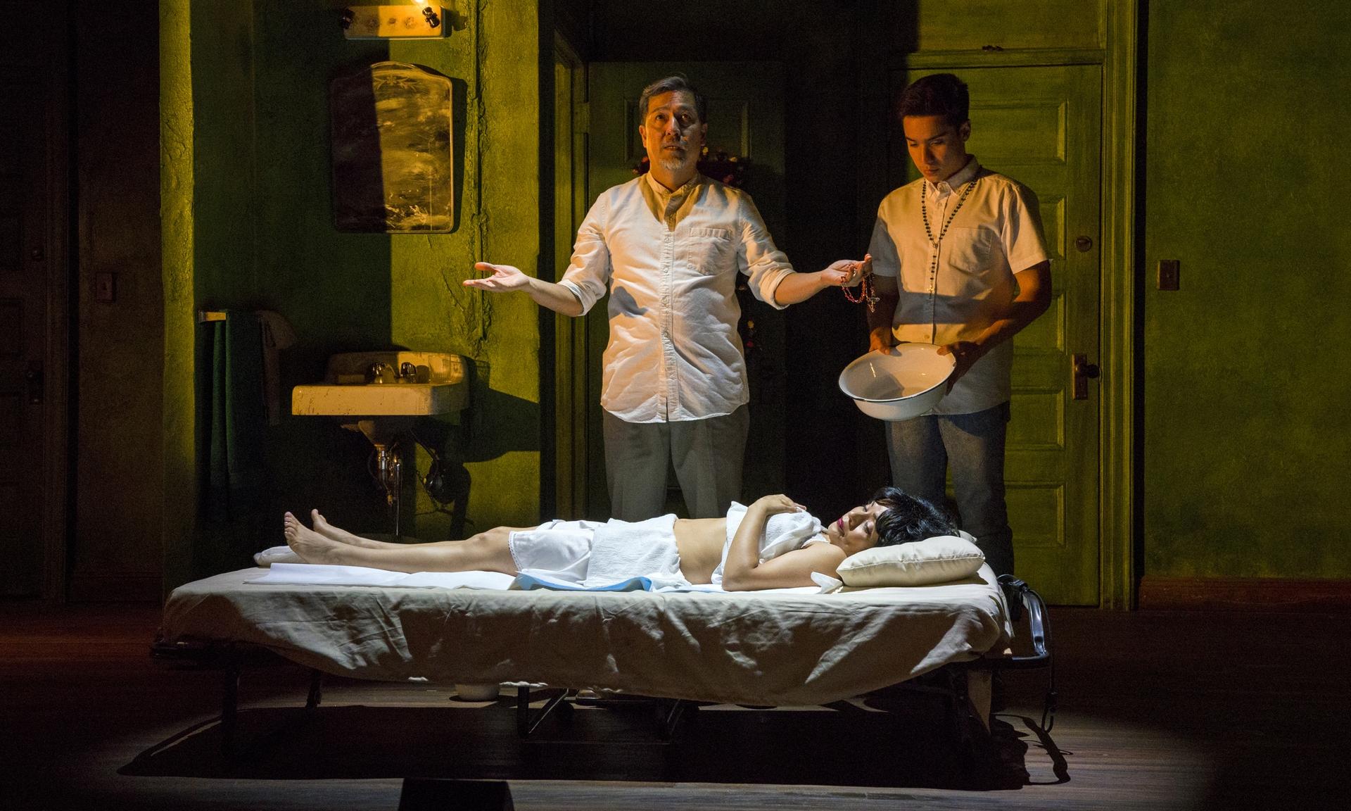 Alan Ariano, Francisca Muñoz (on bed) and Nacho Tambunting in “Felix Starro.”