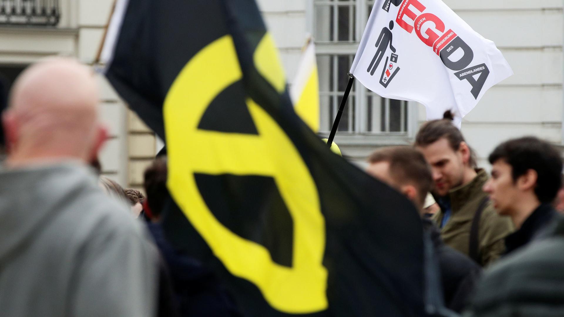 "With Trump, the pride of a whole population has awoken," said the leader of Austria’s Identitarian Party, Martin Sellner, seen at an April 2019 protest where an anti-Islam yellow flag is displayed.
